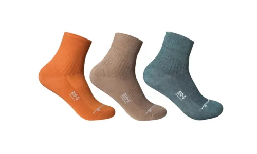 Pair of navy and charcoal wool crew socks with orange and teal heels and toes
